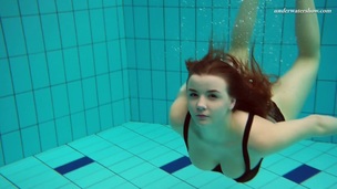 Beautiful Vesta stripping underwater in arousing solo video