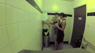 2 bitches are in the public bathroom, licking one one more